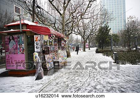 Picture - China, Shanghai, News stand in city. Fotosearch