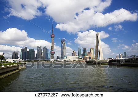 Stock Photo - China, Shanghai, Pudong skyline seen over Huangpu river. Fotosearch