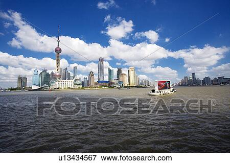 China, Shanghai, Pudong, Tour boat on Huangpu River View Large Photo Image Stock Photo - China, Shanghai, Pudong, Tour boat on Huangpu River. Fotosearch
