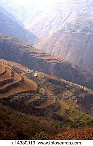 Stock Photo - China, Yunnan Province, Dongchuan, Red Land, Terraced field. Fotosearch