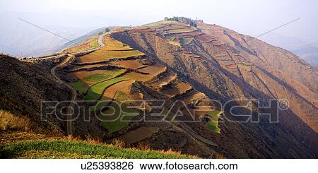 Stock Photograph - China, Yunnan Province, Dongchuan, Red Land, field on mountain. Fotosearch