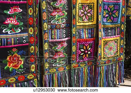 Stock Image - China, Yunnan, Yuanyang, Embroidery. Fotosearch