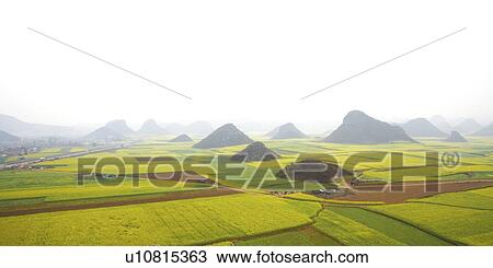 Stock Image - China, Yunnan Province, Golden Rooster Hills. Fotosearch