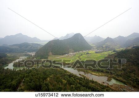 Stock Image - China, Yunnan Province, Luoping County, Nine-dragon Waterfall. Fotosearch