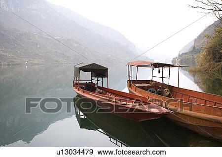 Stock Photo - China, Yunnan Province, Luoping County, Little Three Gorges, Two moored boats. Fotosearch