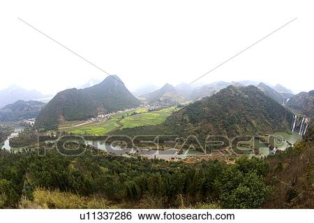 Stock Photograph - China, Yunnan Province, Luoping County, Nine-dragon Waterfall. Fotosearch