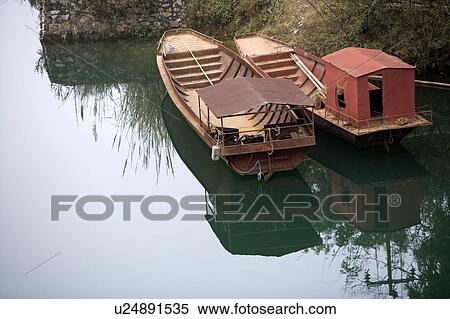 Stock Photography - China, Yunnan Province, Luoping County, Lubuge, moored boats. Fotosearch