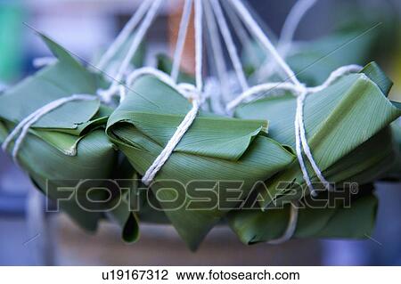 Stock Image - Close-up of green Chinese dumplings. Fotosearch