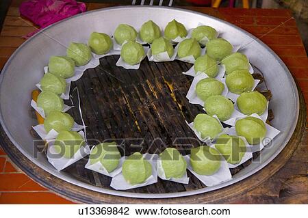 Stock Image - Close-up of green snacks on the pan. Fotosearch