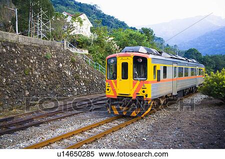 Passenger train on the railroad track in Neiwan, Hengshan, Hsinchu County, Taiwan View Large Photo Image Stock Photography - Passenger train on the railroad track in Neiwan, Hengshan, Hsinchu County, Taiwan. Fotosearch