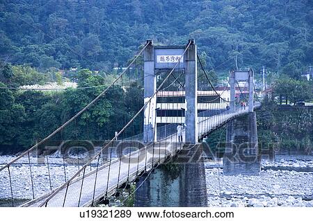 Suspension bridge and mountain in Neiwan, Hengshan, Hsinchu County, Taiwan View Large Photo Image Stock Photo - Suspension bridge and mountain in Neiwan, Hengshan, Hsinchu County, Taiwan. Fotosearch
