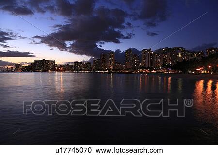 Stock Image - "Night View Of Beach Resort, Honolulu, Hawaii, U. S. A. ". Fotosearch