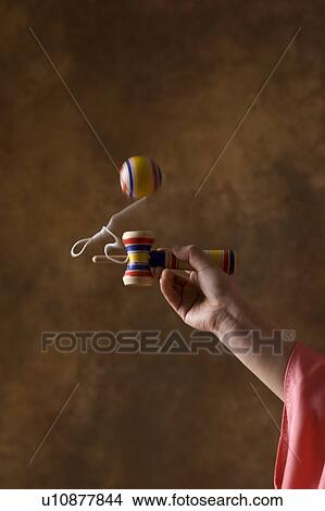 Picture - Playing Cup and Ball. Fotosearch