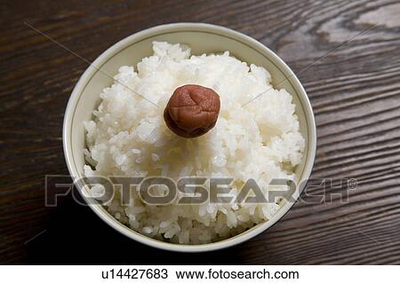 Stock Image - Steamed Rice with Umeboshi. Fotosearch