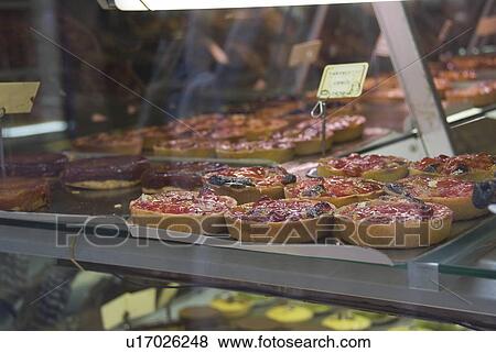 Stock Photo - Tarts in Show Window. Fotosearch