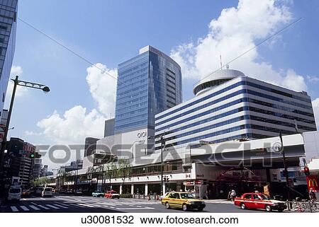 Stock Image - Yurakucho Itocia and Tokyo Koutsukaikan, Tokyo, Japan. Fotosearch