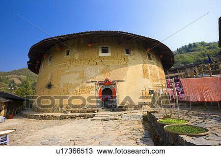 Stock Image - Asia, China, Fujian, Nanjing County, Shuyang Town, Shangban Village, Tianloukeng Tulou Cluster. Fotosearch