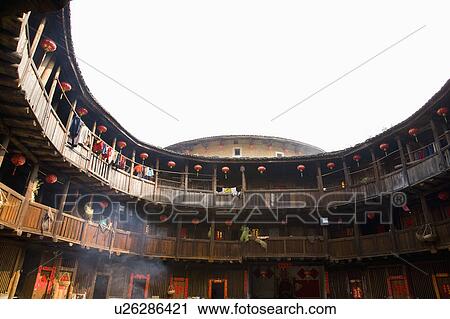 Stock Image - Asia, China, Fujian, Nanjing County, Shuyang Town, Shangban Village, Tianloukeng Tulou Cluster. Fotosearch