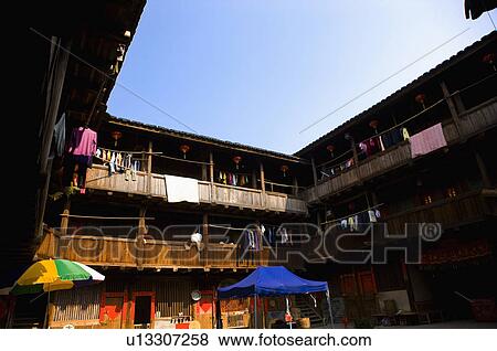 Stock Photo - Asia, China, Fujian, Nanjing County, Shuyang Town, Shangban Village, Tianloukeng Tulou Cluster. Fotosearch