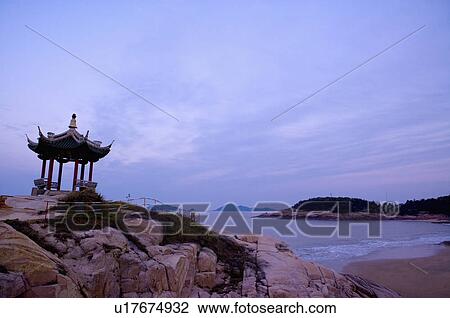 Stock Image - Asia, China, Zhejiang Province, Putuoshan, Puji Temple Scenic Area, Hundred Step Sands. Fotosearch