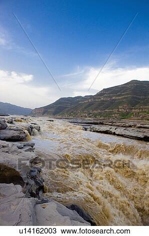 Stock Image - Asia, China, Shanxi, Jixian County, Yellow River, Hukou Waterfall. Fotosearch