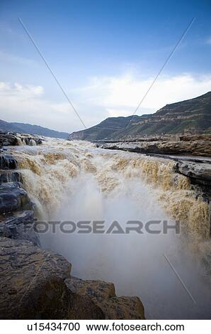 Stock Image - Asia, China, Shanxi, Jixian County, Yellow River, Hukou Waterfall. Fotosearch