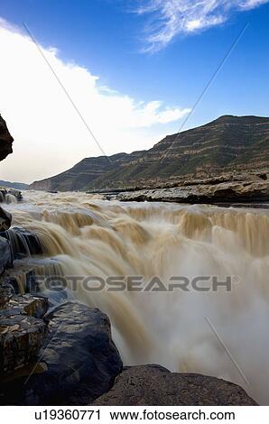 Stock Image - Asia, China, Shanxi, Jixian County, Yellow River, Hukou Waterfall. Fotosearch