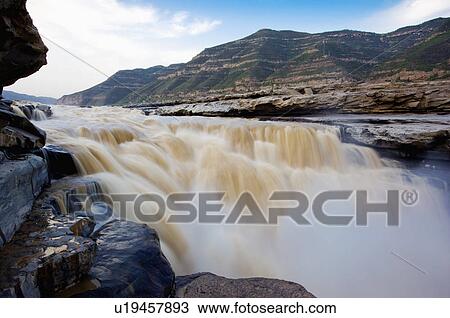 Stock Image - Asia, China, Shanxi, Jixian County, Yellow River, Hukou Waterfall. Fotosearch