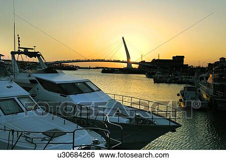 Boats with bridge in the background, Lover's Bridge, Danshui Fisherman's Wharf, Taipei, Taiwan View Large Photo Image Stock Photograph - Boats with bridge in the background, Lover's Bridge, Danshui Fisherman's Wharf, Taipei, Taiwan. Fotosearch