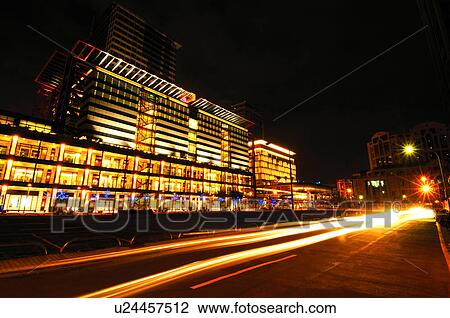 Stock Image - Building lit up in a city at night, Xinyi District, Taipei, Taiwan. Fotosearch