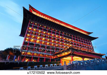Stock Image - Hotel lit up at dusk, Grand Hotel, Taipei, Taiwan. Fotosearch