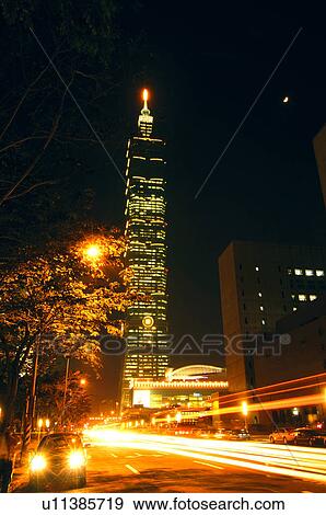 Stock Photo - Skyscraper in a city at night, Taipei 101, Taipei, Taiwan. Fotosearch