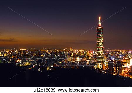 Stock Photo - Skyscraper in a city at night, Taipei 101, Taipei, Taiwan. Fotosearch