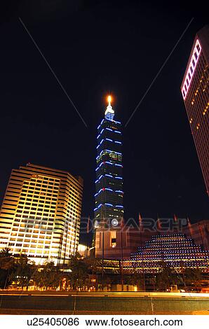 Stock Photograph - Skyscrapers in a city at night, Taipei 101, Taipei, Taiwan. Fotosearch