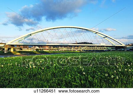 Stock Image - Bridge across a river, Caihong Riverside Park, MacArthur 2nd Bridge, Taipei, Taiwan. Fotosearch