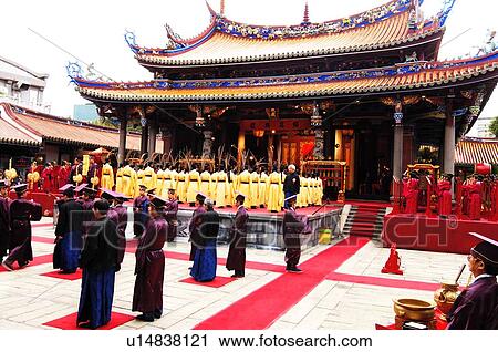 Stock Image - People praying in a temple, Taipei Confucius Temple, Taipei, Taiwan. Fotosearch
