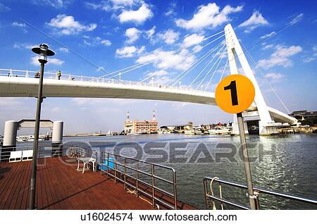 Picture - Pier with bridge in the background, Lovers Bridge, Danshui, Taipei, Taiwan. Fotosearch