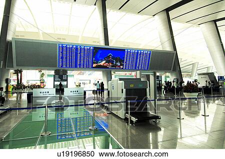 Stock Image - Arrival departure board of an airport, Beijing Capital International Airport, Beijing, China. Fotosearch
