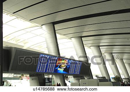 Stock Photo - Arrival departure board of an airport, Beijing, China. Fotosearch