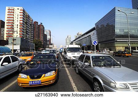 Stock Image - Cars moving on the road, Beijing, China. Fotosearch