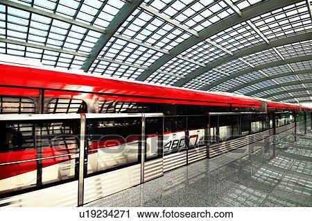 Stock Image - Intra-terminal train at a railroad station in the airport, Beijing Capital International Airport, Beijing, China. Fotosearch