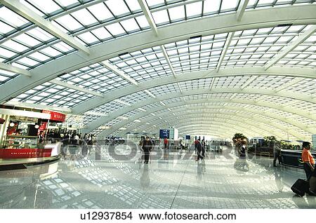 Picture - Passengers in an airport, Beijing Capital International Airport, Beijing, China. Fotosearch