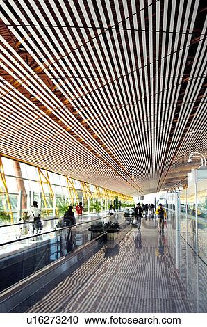 Stock Image - Passengers in an airport, Beijing Capital International Airport, Beijing, China. Fotosearch