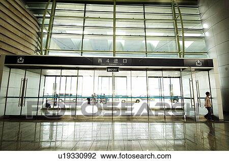 Passengers in the airport, Beijing, China View Large Photo Image Stock Image - Passengers in the airport, Beijing, China. Fotosearch