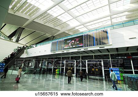 Passengers in the airport, Beijing, China View Large Photo Image Stock Photography - Passengers in the airport, Beijing, China. Fotosearch