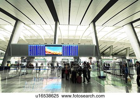 Stock Photography - Passengers in the airport, Beijing, China. Fotosearch