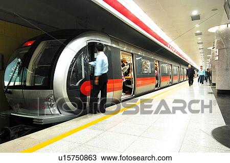 Passengers traveling in a subway train, Beijing, China View Large Photo Image Stock Image - Passengers traveling in a subway train, Beijing, China. Fotosearch