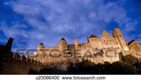 France, Languedoc, Carcassonne, Castle walls illuminated at night View Large Photo Image Stock Image - France, Languedoc, Carcassonne, Castle walls illuminated at night. Fotosearch