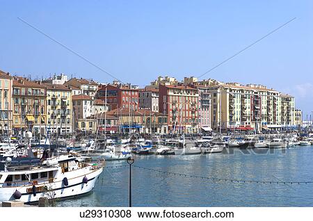 Stock Photo - Fishing boats docked at a harbor, Nice, French Riviera, France, Europe. Fotosearch
