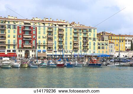 Stock Photograph - Fishing boats docked at a harbor, Nice, French Riviera, France, Europe. Fotosearch